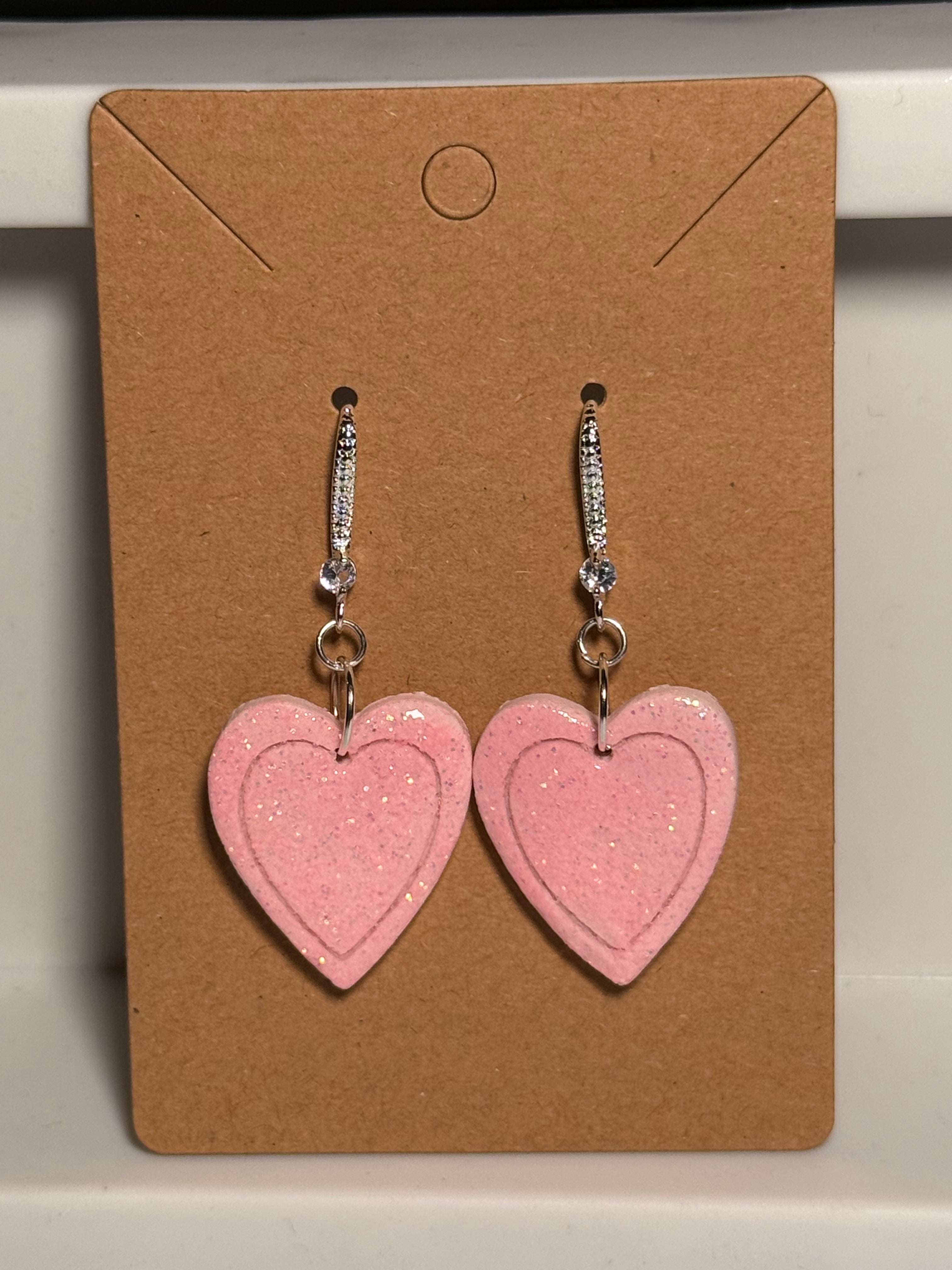 Heart within pink heart earrings