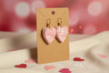 Pink heart shaped earrings with clasp hooks