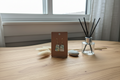 Ocean Marble Trapezoid Clay Earrings on warm wood surface with bright coastal styling